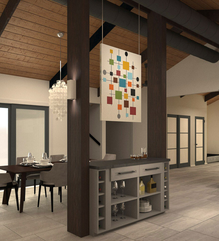 The image displays a modern kitchen with a contemporary design, featuring dark wood flooring, light-colored walls, a large island with a countertop, a built-in oven, a sink, and various cabinets. The space includes a dining table and chairs, as well as a decorative piece on the wall with a colorful pattern.